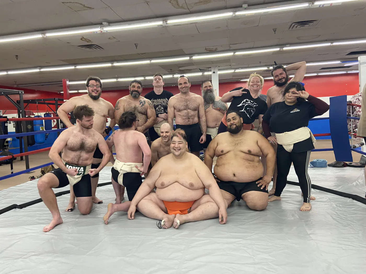 Club members posing together on the ring